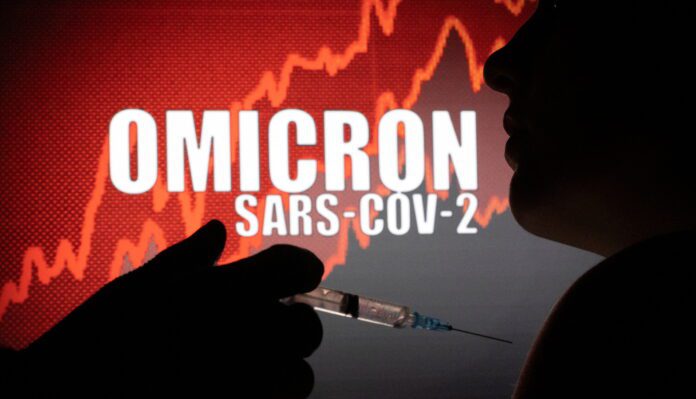 People pose with syringe with needle in front of displayed words